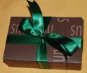 Green Printed Corporate ribbon wrapped round individual chocolate boxes (click to enlarge)