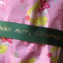 Green printed ribbon with gold print ideal to wrap Christmas gifts, Christmas presents (click to enlarge)