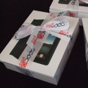 iPad corporate gift wrapped in personalised printed 50mm white ribbon with full colour permanent textile print (click to enlarge)